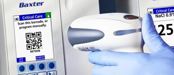A healthcare provider scans a QR code on a medical device