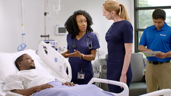 A healthcare team member is trained on a connected medical device implementation