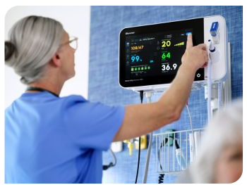 a nurse uses a Connex 360 device in a med surg setting